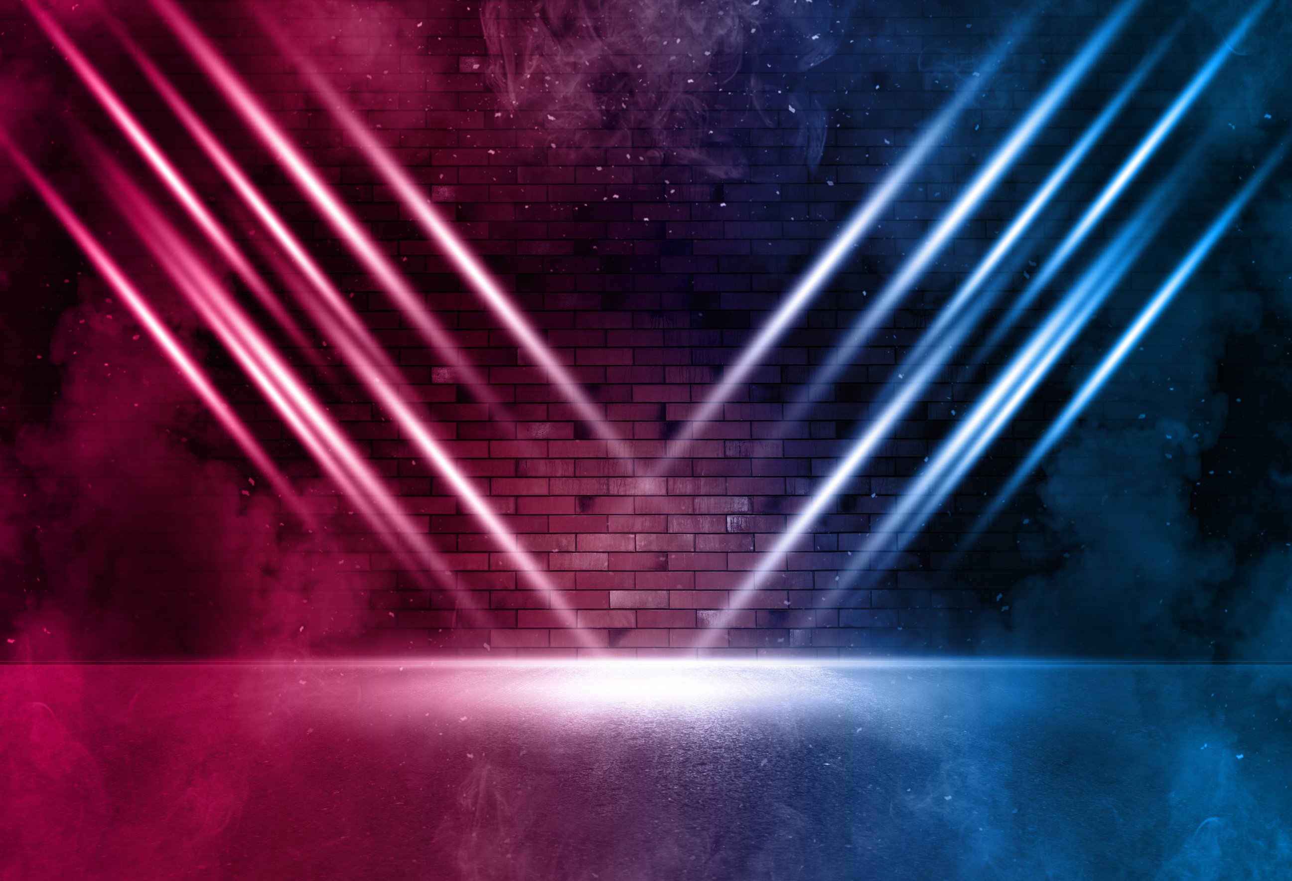 Rays neon light on neon brick wall with smoke. Neon reflections on wet asphalt. Empty scene with copy space.
